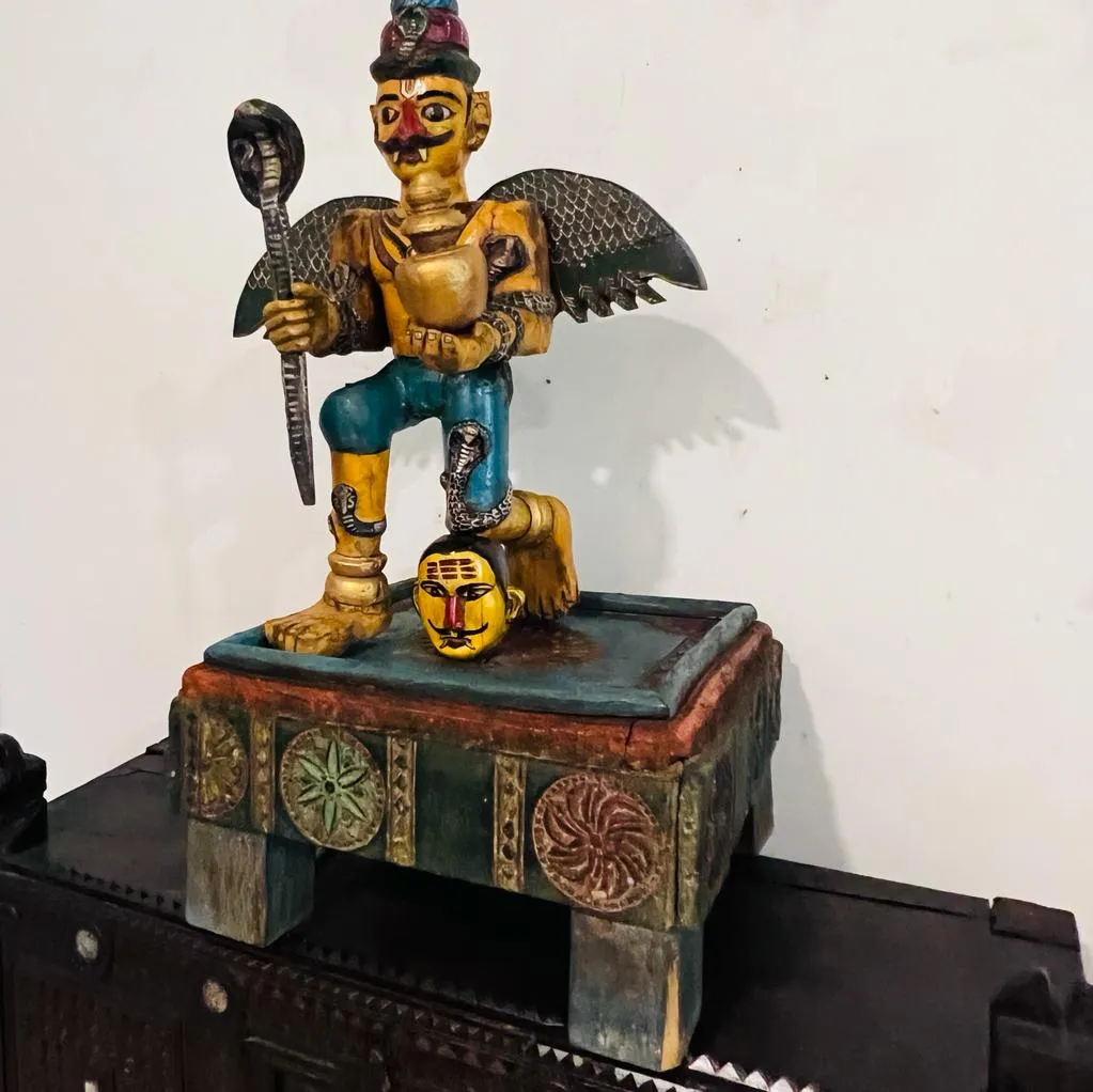 Garuda  : Handpainted Wooden Sculpture with unusual Colouring seated on a chowki (33 inches )